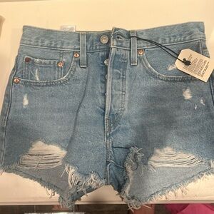 Levi’s 501 denim cut offs, light wash. Brand new with tags.